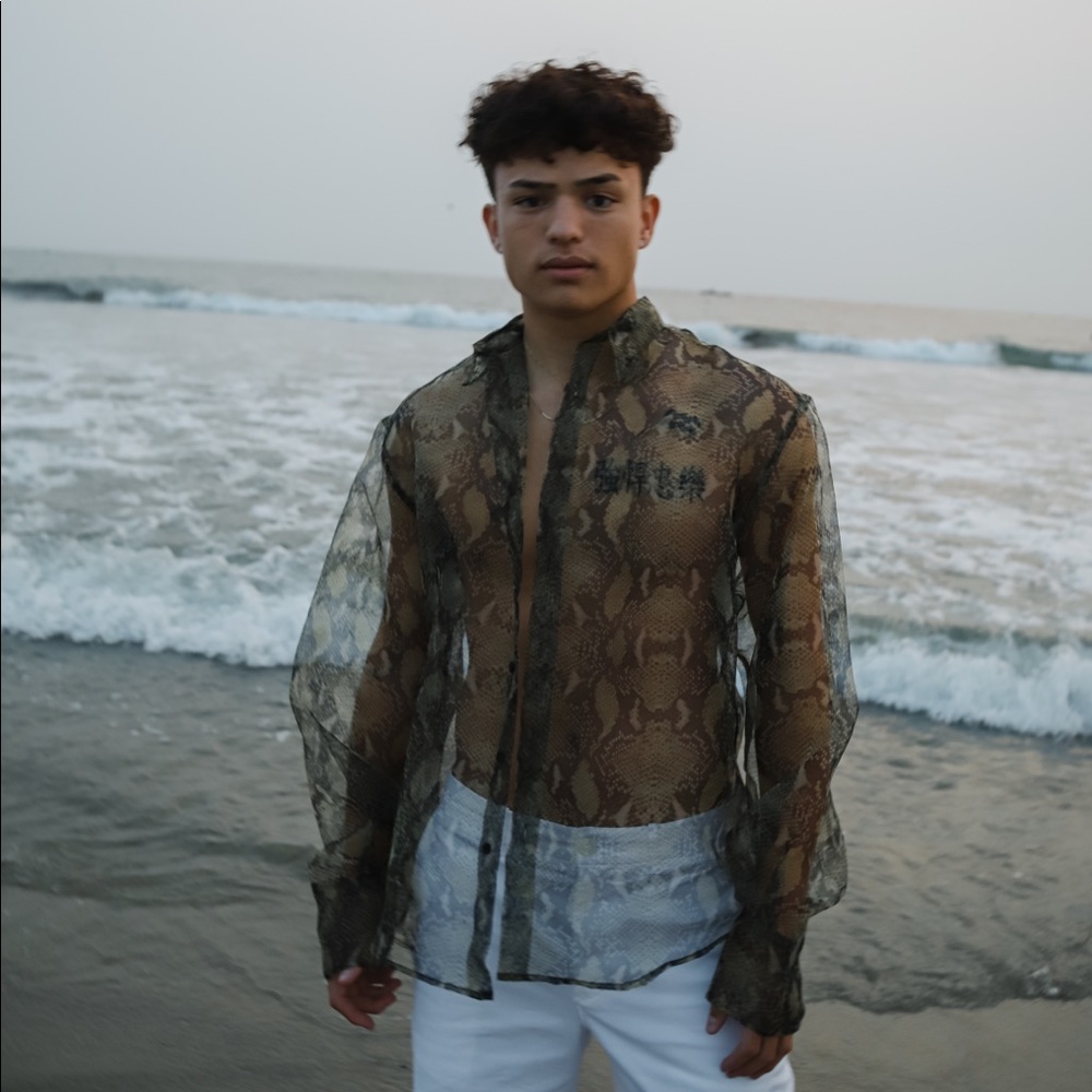 CMMN SWDN long sleeve button up shirt.